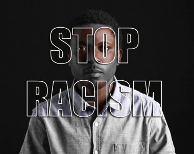 Siyah arka planda üzgün bir Afro-Amerikalı. Irkçılığı bırak