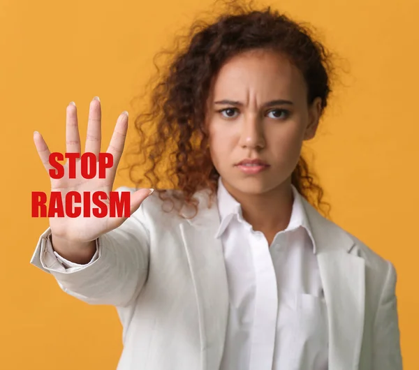 African-American woman with text STOP RACISM on color background