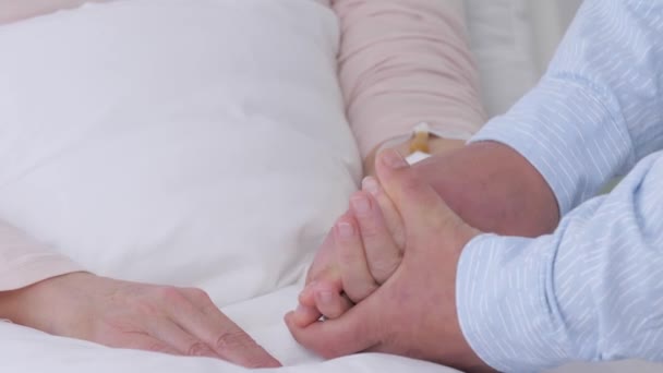 Man Calming His Mother Hospital Closeup — Stock Video