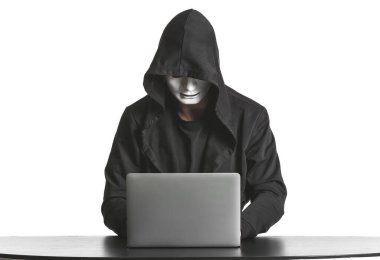 Professional hacker using laptop at table against white background clipart