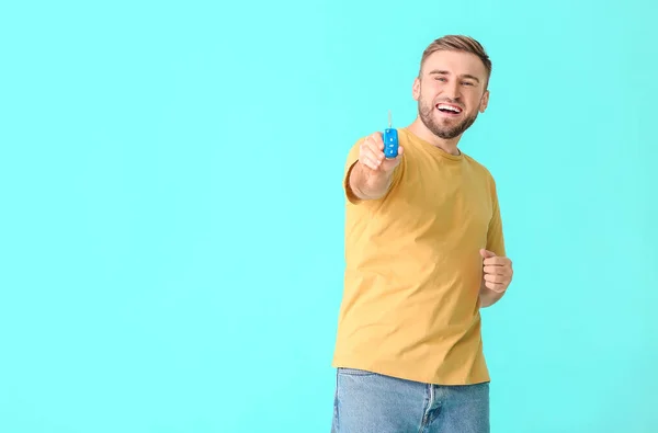 Happy Young Man Car Key Color Background — Stock Photo, Image