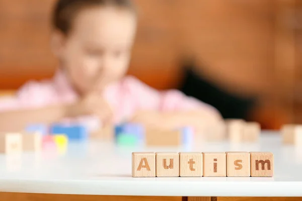 Wooden Cubes Word Autism Table Little Girl — Stock Photo, Image