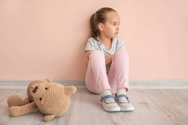 Sad Little Girl Autistic Disorder Toy Sitting Color Wall — Stock Photo, Image
