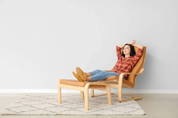 Young Woman Relaxing Armchair Light Wall — Stock Photo, Image