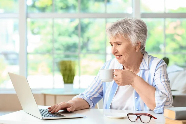 Senior Woman Working Laptop Drinking Tea Home — Stock Photo, Image