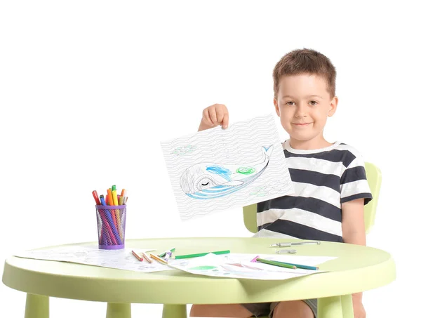 Cute little boy coloring pictures on white background