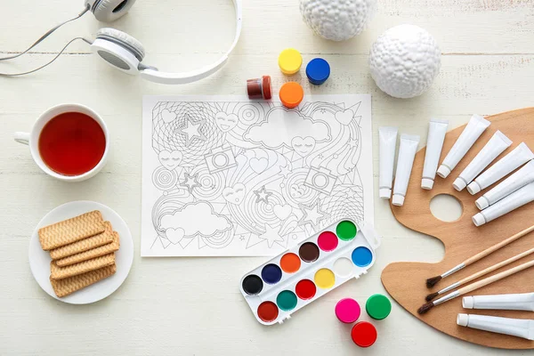 Composition with coloring picture on table