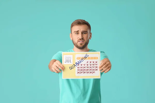 Troubled Man Holding Calendar Written Word Quarantine Color Background — Stock Photo, Image