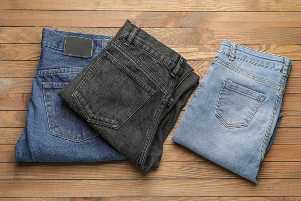 Stylish Jeans Pants Wooden Background — Stock Photo, Image