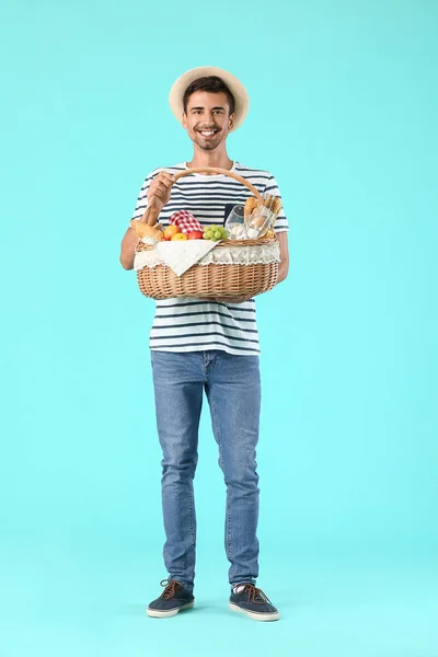 Young Man Food Picnic Basket Color Background — Stock Photo, Image