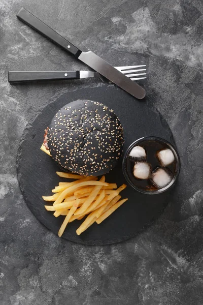 Tasty Burger Black Bun French Fries Cola Drink Dark Background — Stock Photo, Image