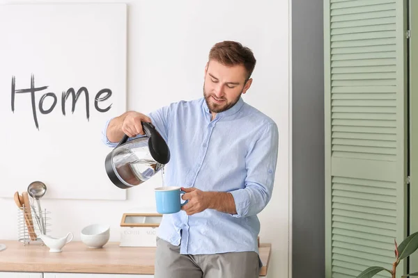 Man Pouring Hot Boiled Water Electric Kettle Cup Home — Stock Photo, Image