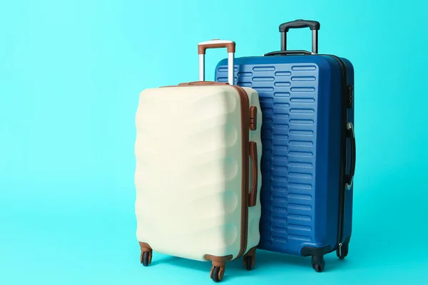 Packed suitcases on color background. Travel concept