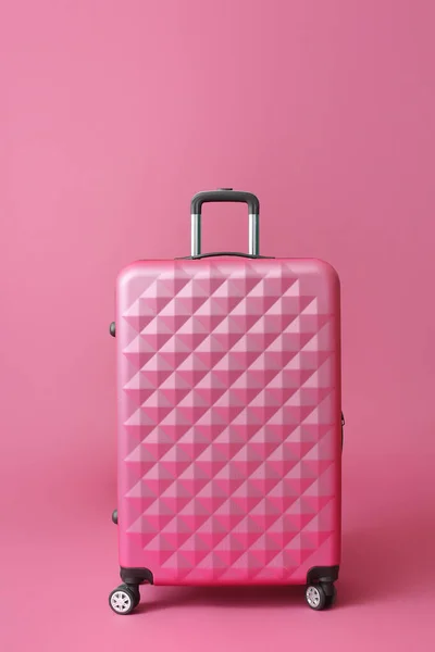 Packed suitcase on color background. Travel concept