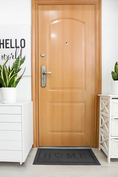 Interior of modern stylish hallway with door mat