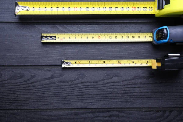 Measuring Tapes Wooden Background — Stock Photo, Image