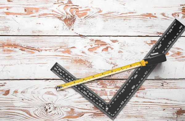 Measuring tape with ruler on table