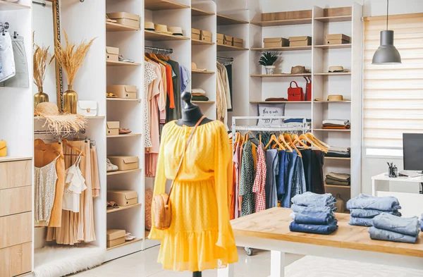 Stylish interior of modern clothes store