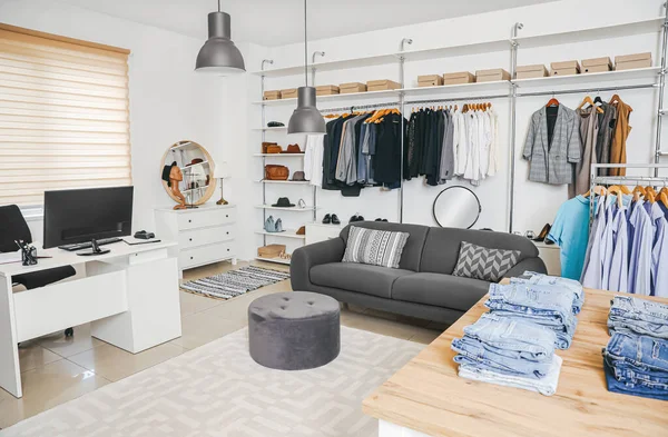 Stylish interior of modern clothes store