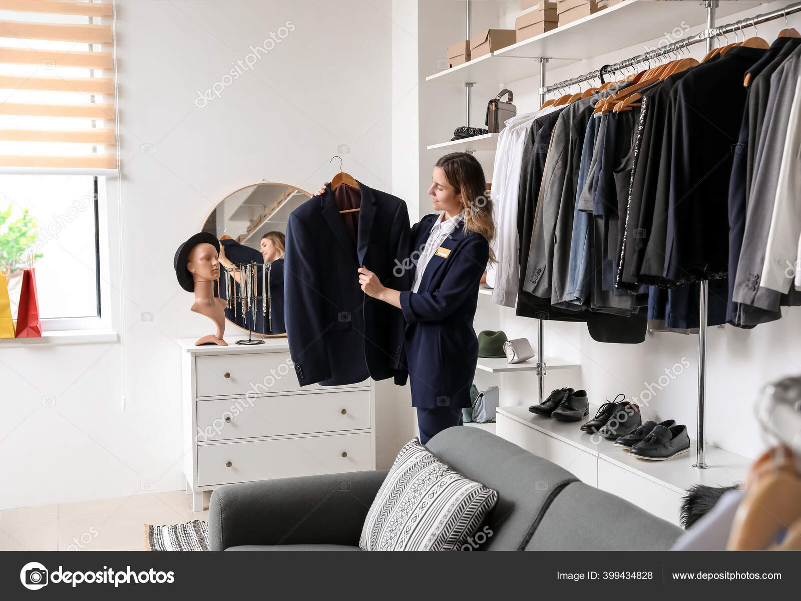 Female Seller Modern Clothes Store Stock Photo by ©serezniy 399434828