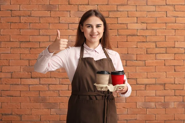 Female Barista Showing Thumb Brick Background — Stock Photo, Image