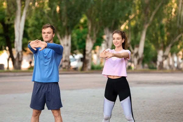 Sporty Young Couple Training Outdoors — Stock Photo, Image