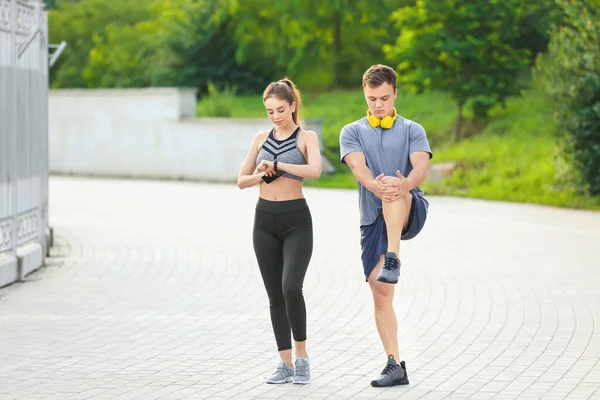 Sporty Young Couple Training Outdoors — Stock Photo, Image