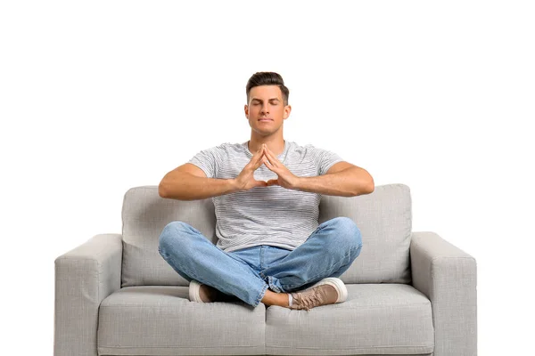 Young Man Meditating Sofa White Background — Stock Photo, Image