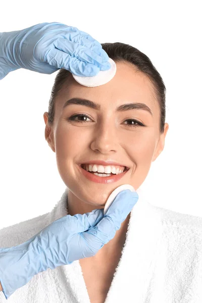 Beautician Wiping Face Young Woman Cotton Pads White Background — Stock Photo, Image