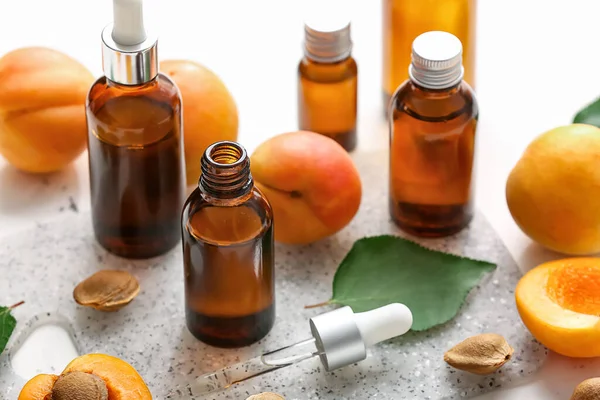 Bottles Apricot Essential Oil White Background — Stock Photo, Image