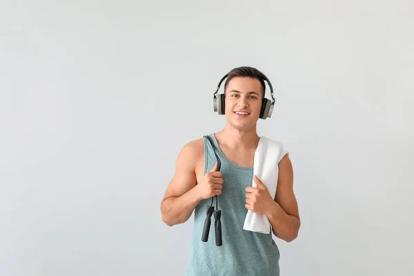 Sporty Young Man Headphones Light Background — Stock Photo, Image
