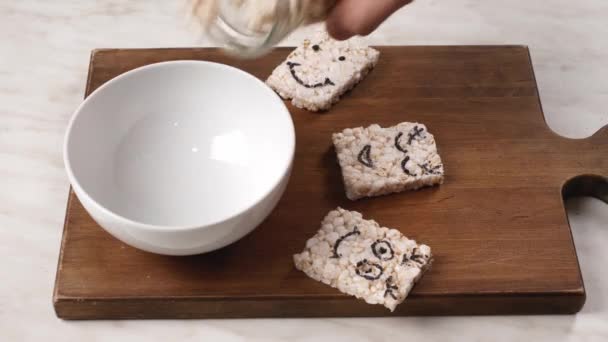 Man Pouring Crispy Sweet Rice Jar Bowl Table — Stock Video