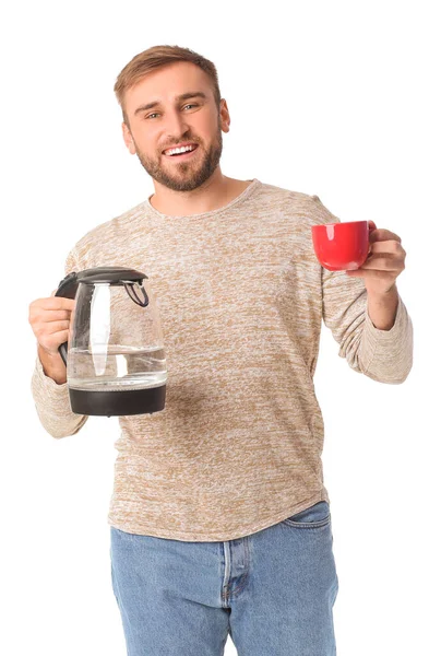 Junger Mann Mit Wasserkocher Und Tasse Auf Weißem Hintergrund — Stockfoto