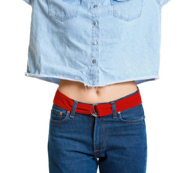 Beautiful young woman in jeans clothes on white background