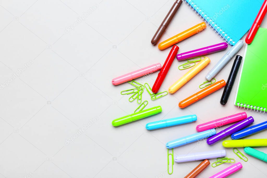 Set of school stationery on grey background