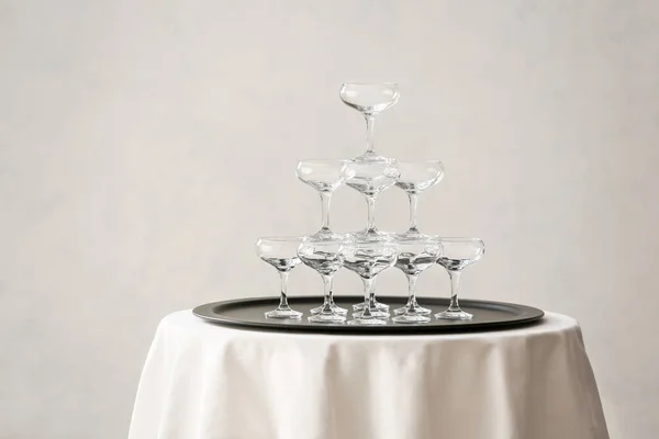 Tower Made Empty Glasses Table Grey Background — Stock Photo, Image