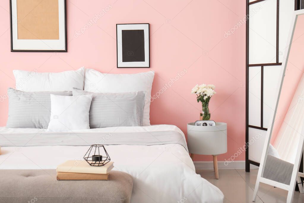 Stylish interior of room with big bed