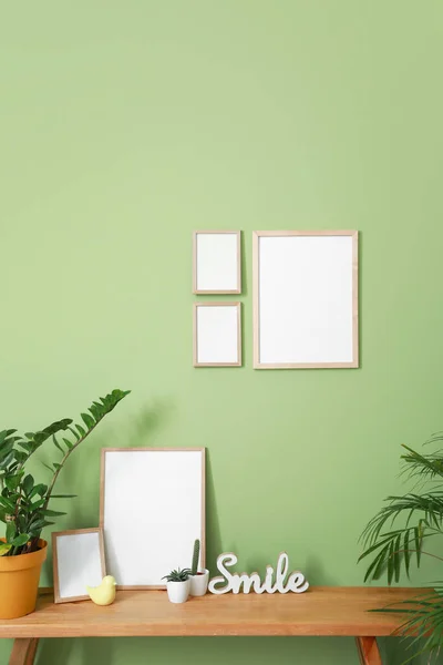 Interior of room with blank picture frames