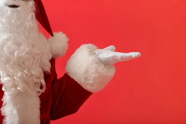 Santa Claus Holding Something Color Background — Stock Photo, Image