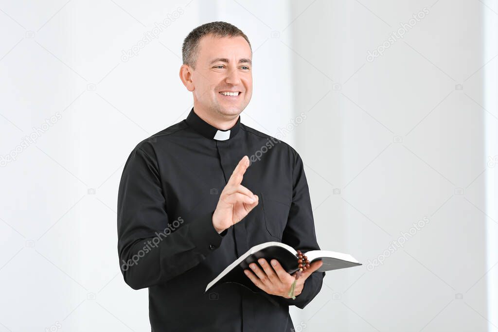 Portrait of male priest at home