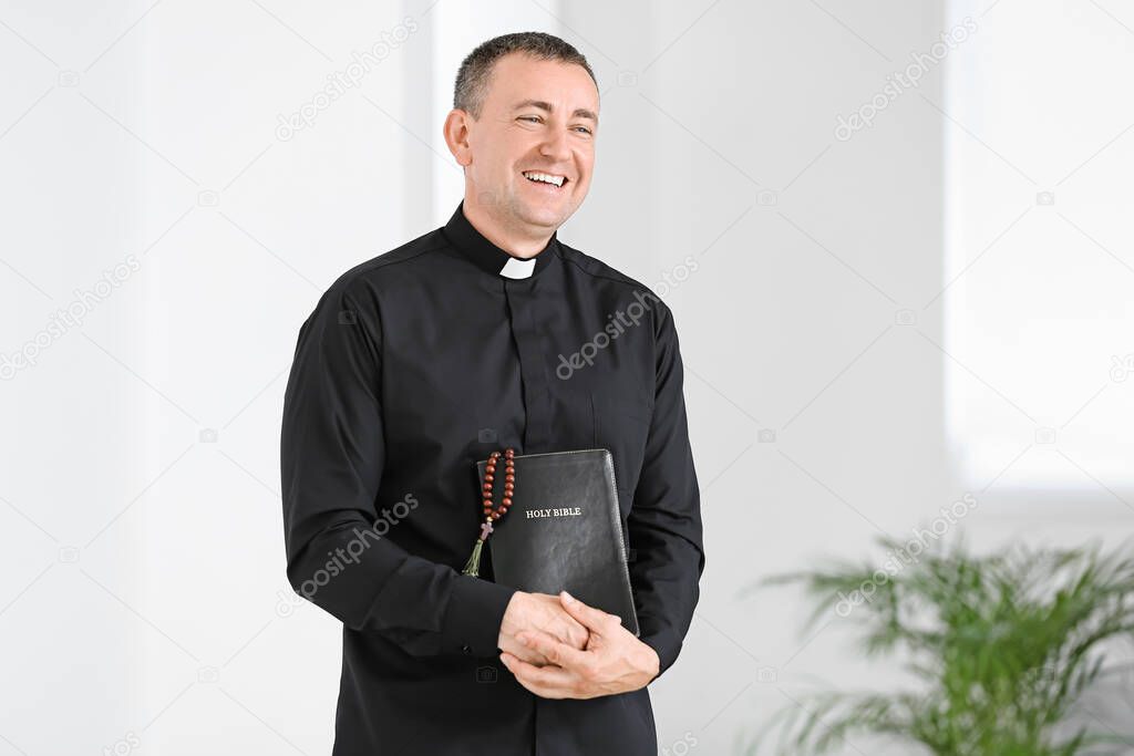 Portrait of male priest at home