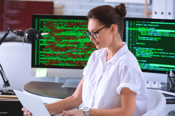 Female programmer working in office