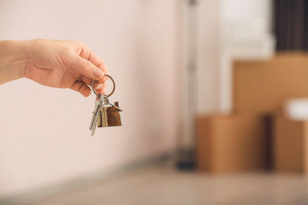 Owner with keys from new house indoors