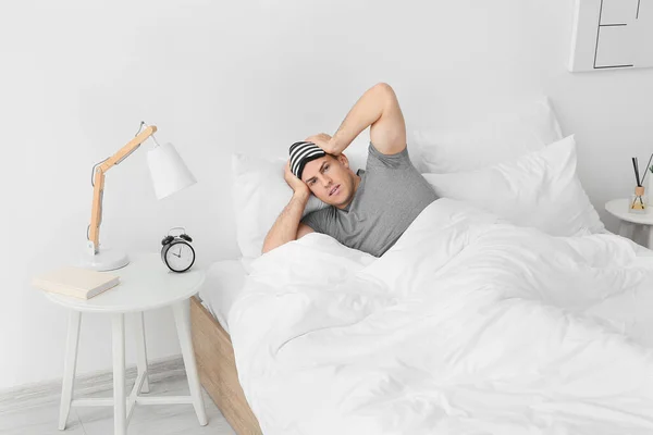 Young Man Alarm Clock Suffering Insomnia Bedroom — Stock Photo, Image