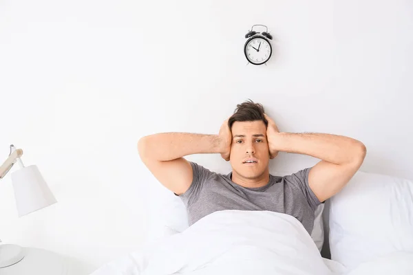 Young Man Alarm Clock Suffering Insomnia Bedroom — Stock Photo, Image