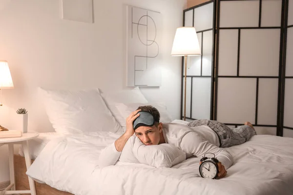 Young Man Alarm Clock Suffering Insomnia Bedroom — Stock Photo, Image