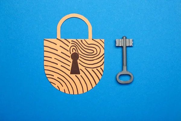 Paper padlock with key on color background