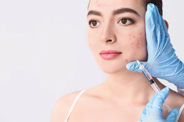Young Woman Acne Problem Receiving Injection Her Face Light Background — Stock Photo, Image