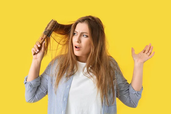 Stressed Woman Brushing Hair Color Background — Stock Photo, Image