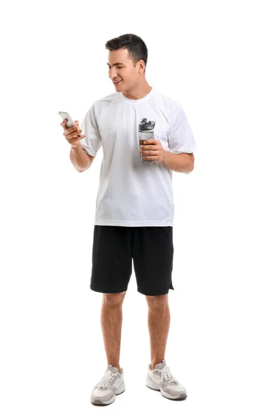Sportovní Mladý Muž Lahví Vody Telefonu Bílém Pozadí — Stock fotografie
